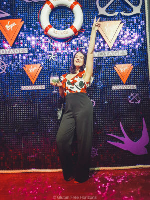 Striking a pose at Virgin Voyages Scarlet Night party. Jumpsuit by Quiz Clothing
